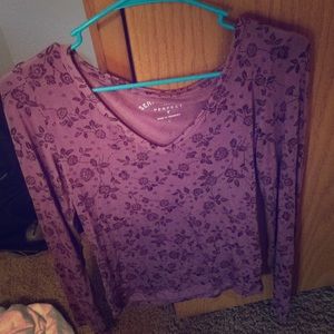 A purple v-neck with dark purple flowers